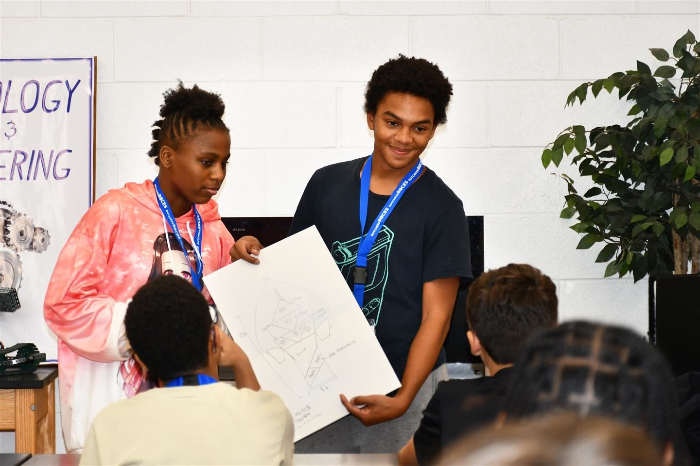 Alexis Rihanna Bali-Spence, from Poughkeepsie, and David Mahecha, from Arlington, present their design to classmates